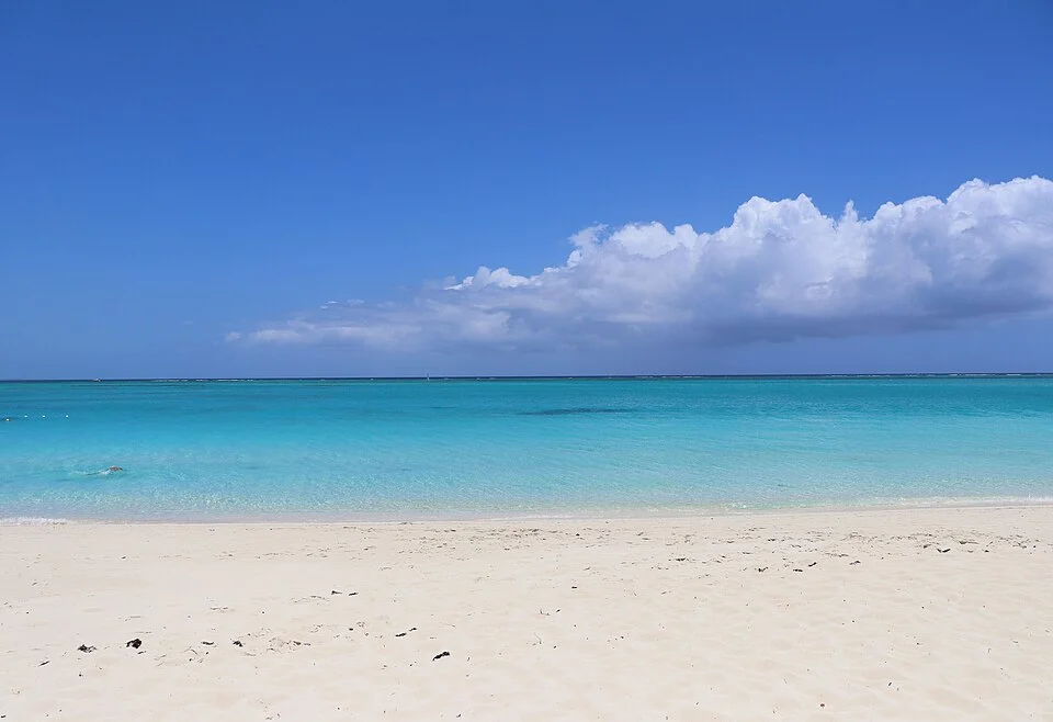 Clear shallow water and pale sand at Grace Bay, Providenciales
